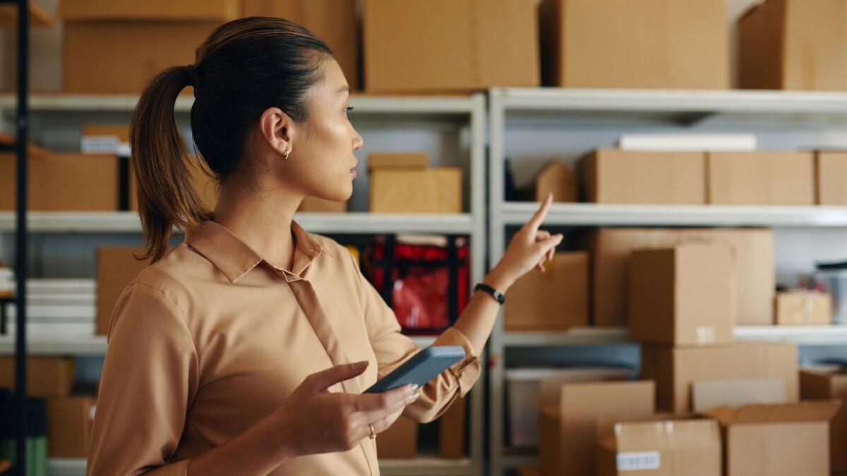 A woman planning how to organise packages